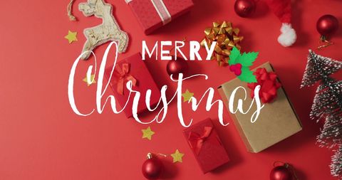 Festive Christmas Decorations with Presents on Red Background