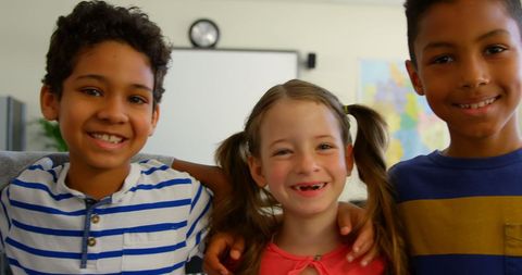 Joyful Multi-Ethnic Children Smiling Together in Classroom