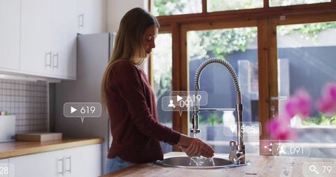 Woman Practicing Hand Hygiene in Modern Kitchen With Social Media Overlay