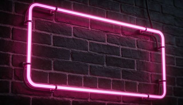 Glowing magenta neon rounded rectangle sign casting halo on dark brick wall