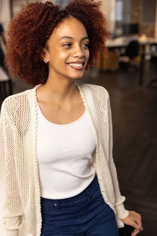 Smiling professional african american woman in casual office attire