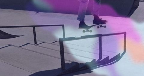 Skateboarder Performing Trick on Ramp with Colorful Light Effects