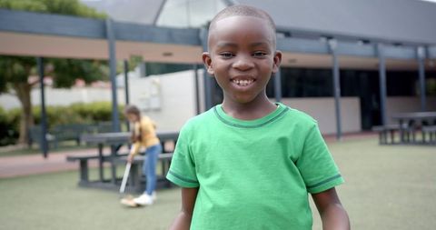 Joyful child smiling during school recess outdoors