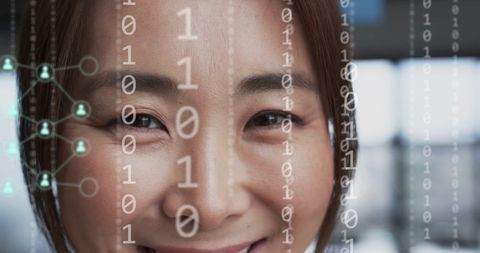 Businesswoman Surrounded by Digital Data Interfaces and Binary Code