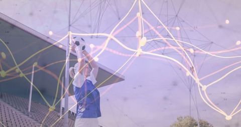 Female athlete preparing soccer throw with graph overlay