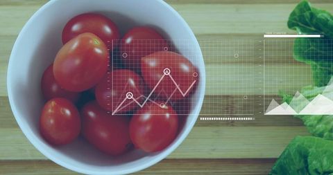 Cherry Tomatoes Bowl with Economic Graph Overlay in Kitchen