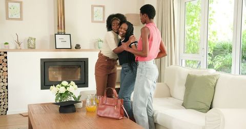 Joyful Female Friends Celebrating Graduation at Home