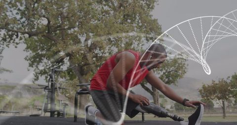 Athlete with Prosthetic Leg Stretching Outdoors with DNA Graphics