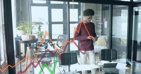 Businessman Analyzing Data Trends in Modern Office Environment