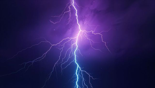 Dynamic Lightning Bolt Illuminating Dramatic Night Sky