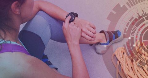 Woman using smartwatch for fitness tracking during climbing session