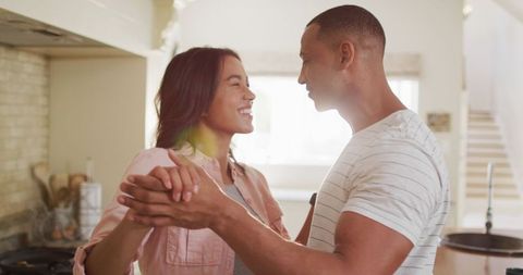 Couple Dancing Happily Together in Kitchen Home Love