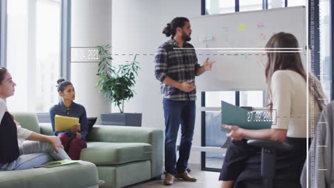 Creative Team Brainstorming with Virtual Data Interface in Modern Office