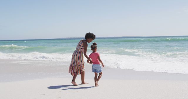 Parent and Child Walking on Beach Shore on Sunny Day - Download Free Stock Images Pikwizard.com