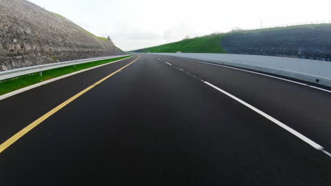 Highway View with Green Landscape Passing By