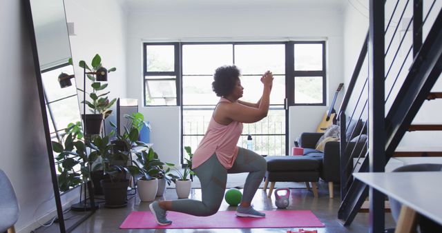 Woman Exercising with Lunges in Modern Home Living Space - Download Free Stock Images Pikwizard.com