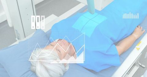 Elderly woman lying on radiology scanner table in blue gown with medical data overlays