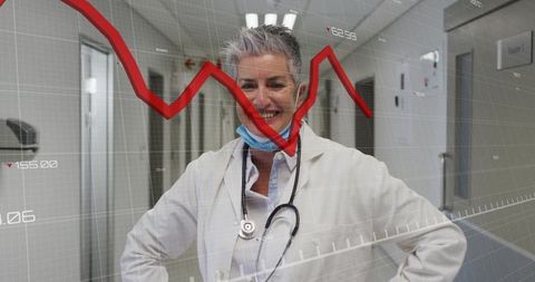 Senior Female Doctor with Data Analytics in Hospital Corridor