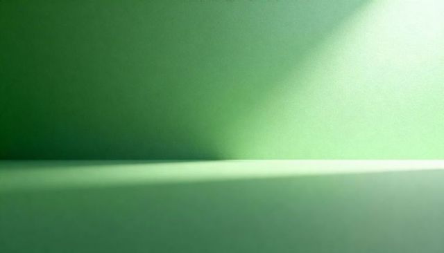 Minimalist green tabletop and wall with diagonal light gradient and seam