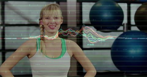 Smiling fitness instructor in exercise studio overlayed with data visualizations