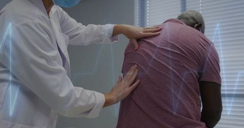 Healthcare professional assessing patient with ecg overlay