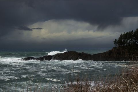 Stormy Coastal Scene with Waves and Dramatic Clouds