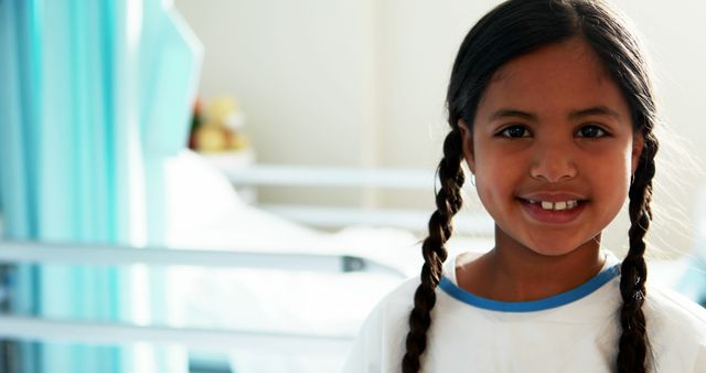 Smiling Girl with Braids in Hospital Room - Download Free Stock Images Pikwizard.com