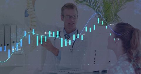 Doctor explaining spine model with digital chart overlay