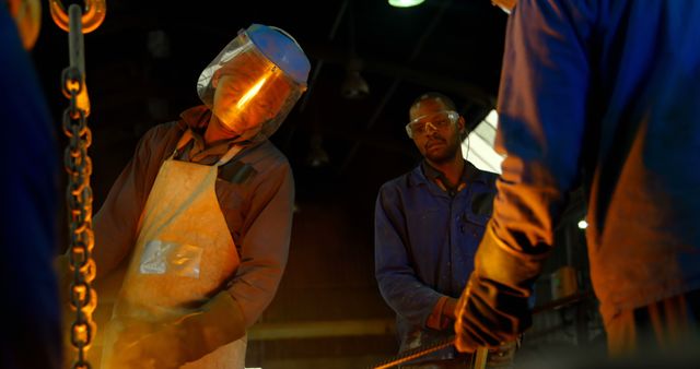 Industrial Workers in a Metal Workshop Wearing Protective Gear - Download Free Stock Images Pikwizard.com