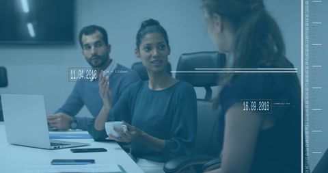 Business professionals collaborating over data in modern office