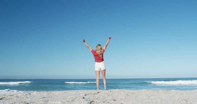 Woman Celebrating Freedom on Sunny Beach - Download Free Stock Images Pikwizard.com