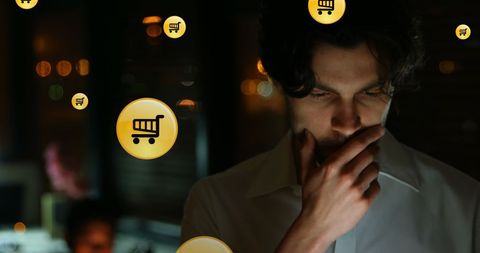 Businessman contemplating digital e-commerce solutions at night