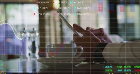 Businessman analyzing data on digital tablet in cafe
