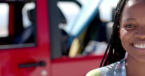 Smiling Woman Enjoying Sunny Road Trip in Relaxed Outdoor Setting