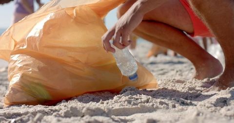 Volunteers Cleaning Beach to Promote Environmental Awareness