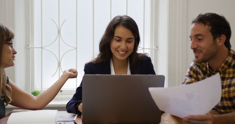 Team Collaborating in Bright Office Environment