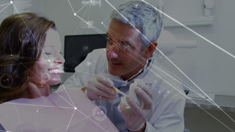 Dentist Demonstrating Procedure with Data Overlay Technology