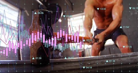 Shirtless athlete swinging sledgehammer hitting tire with analytics overlay industrial gym