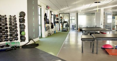 Rehabilitation Center with Exercise Equipment and Therapy Tables - Download Free Stock Images Pikwizard.com