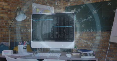 All-in-one desktop displaying terminal output and hud overlay in industrial loft workspace