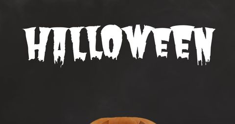 Halloween Text with Carved Pumpkin on Dark Background - Download Free Stock Images Pikwizard.com