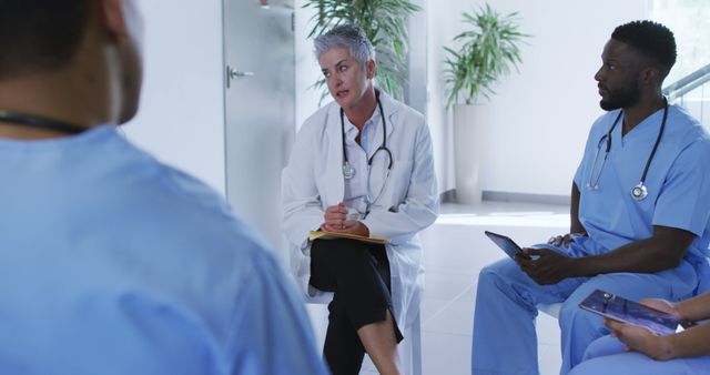 Doctors Discussing Medical Case in Modern Hospital Office - Download Free Stock Images Pikwizard.com