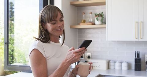 Middle-Aged Caucasian Woman Relaxing with Morning Coffee at Home