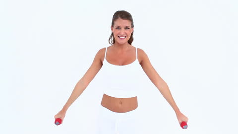 Smiling Woman Exercising with Dumbbells on White Background