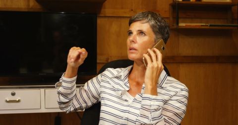 Woman Communicating on Smartphone in Office Environment