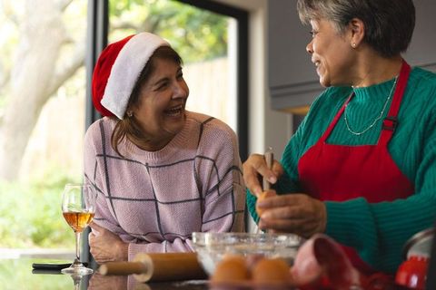Diverse Senior Friends Baking in Festive Kitchen