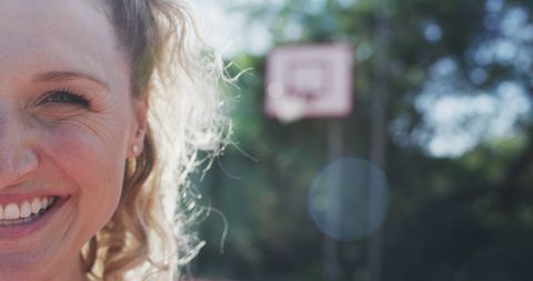 Cheerful Basketball Player on Outdoor Court