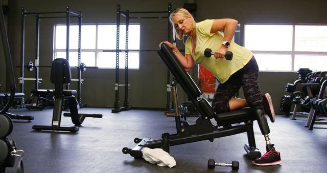 Determined Woman with a Prosthetic Leg Exercising in Gym - Download Free Stock Images Pikwizard.com