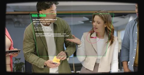 Collaborating team reviewing executive dashboard hud with sticky notes in openplan office