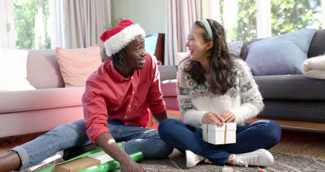 Happy Couple Exchanging Christmas Gifts in Cozy Living Room - Download Free Stock Images Pikwizard.com